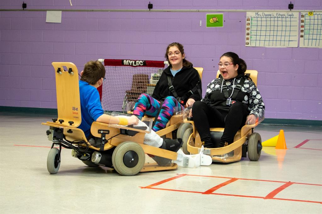 Athletes participate in Volt Hockey in a gym